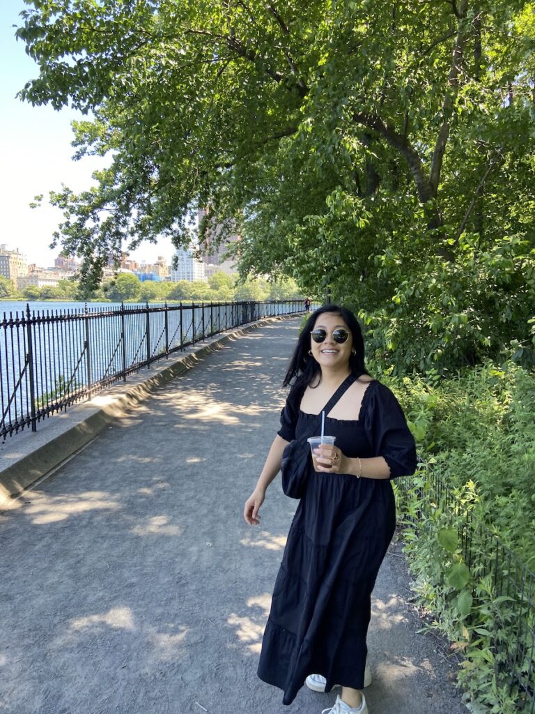 walking along the water in Central Park on a summer day